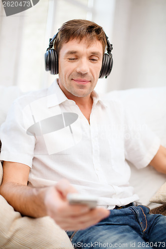Image of man with headphones listening to music