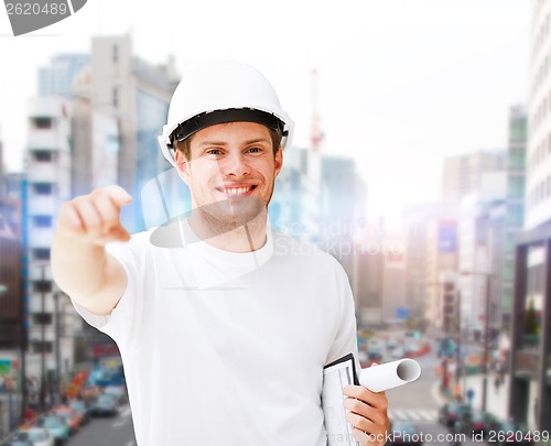Image of male architect in helmet pointing at you