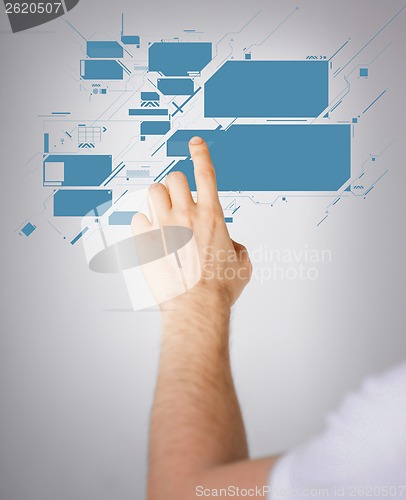 Image of man hand pointing at virtual screen