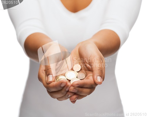 Image of womans cupped hands showing euro coins