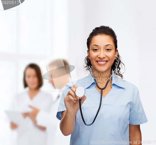 Image of smiling female african american doctor or nurse