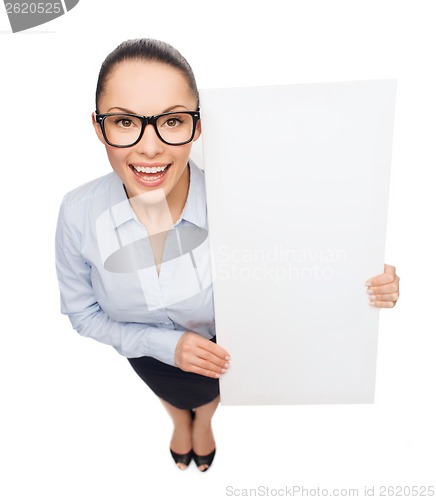 Image of smiling businesswoman with white blank board