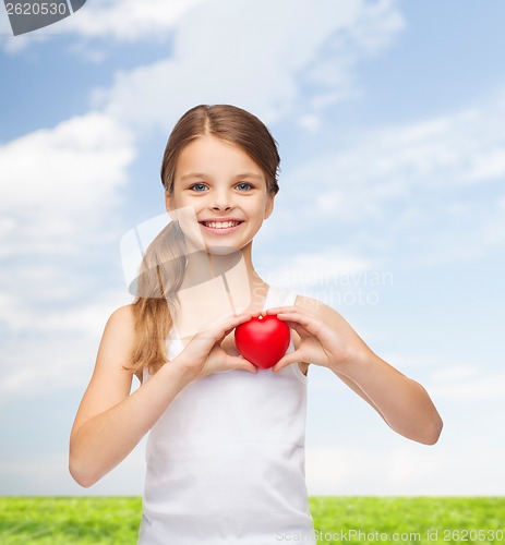 Image of girl in blank white shirt with small red heart