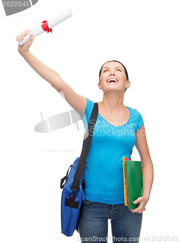 Image of smiling student with bag and folders