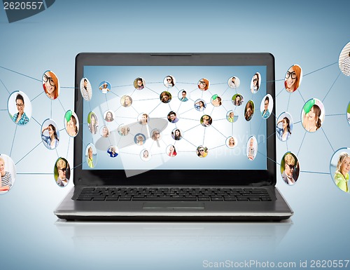 Image of laptop computer with social network on screen