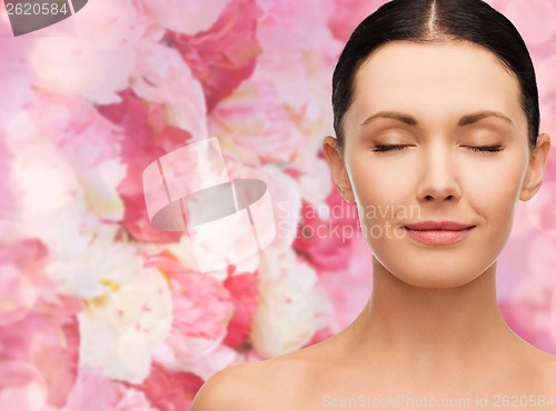 Image of young calm woman with closed eyes