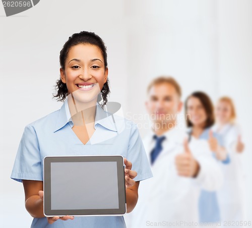 Image of smiling female doctor or nurse with tablet pc