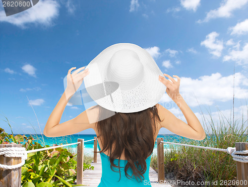 Image of model in swimsuit with hat