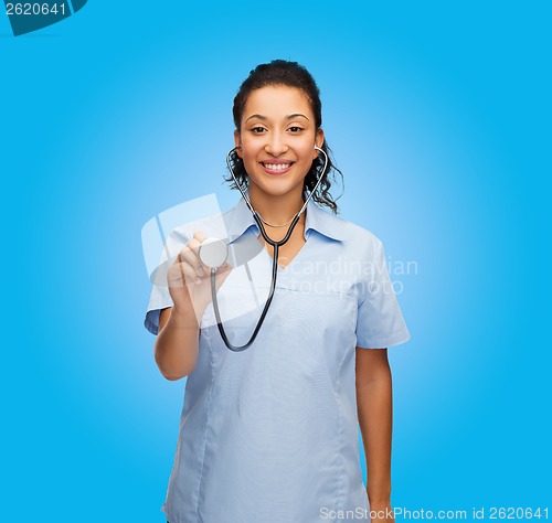 Image of smiling female african american doctor or nurse