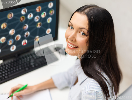 Image of smiling businesswoman with computer