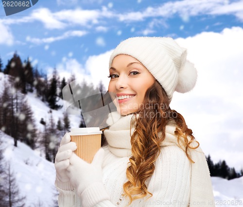 Image of woman in hat with takeaway tea or coffee cup