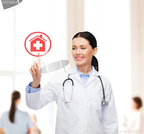 Image of smiling female doctor pointing to something