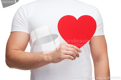 Image of closeup of man hands with heart