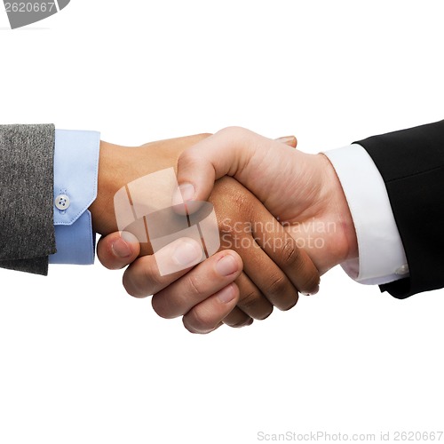 Image of businessman and businesswoman shaking hands