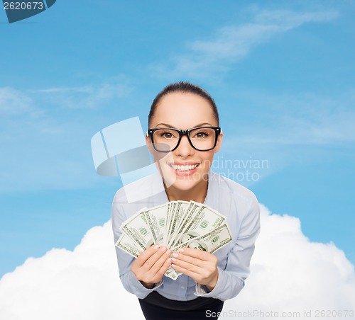 Image of smiling businesswoman with dollar cash money