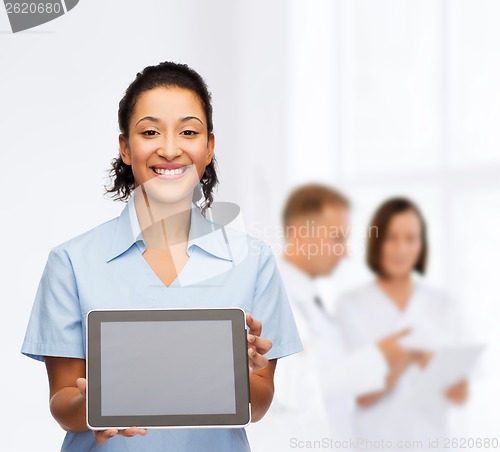 Image of smiling female doctor or nurse with tablet pc