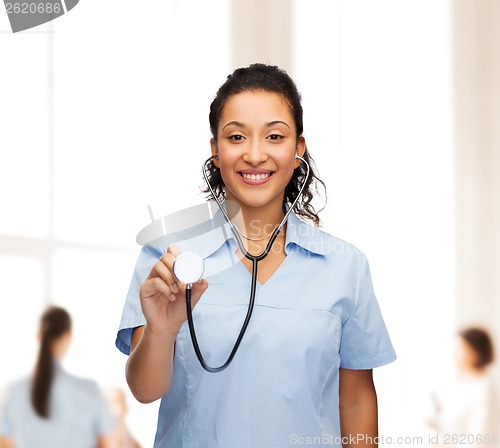 Image of smiling female african american doctor or nurse