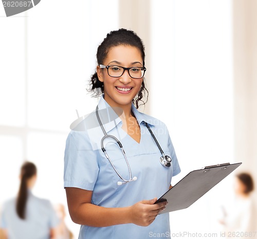 Image of smiling female african american doctor or nurse