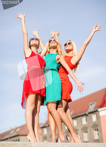 Image of three beautiful women in the city