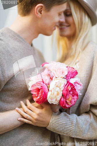 Image of couple with flowers in the city