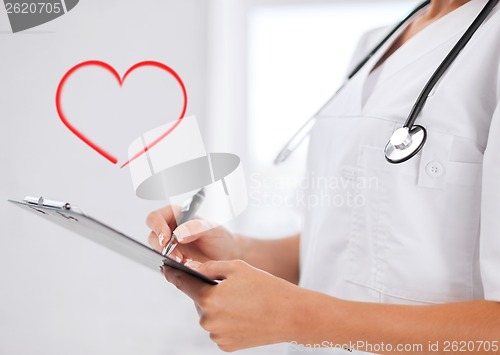 Image of female doctor with stethoscope and prescription