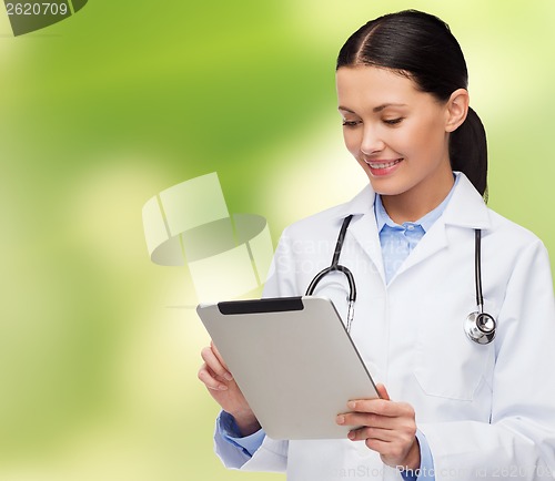 Image of female doctor with stethoscope and tablet pc