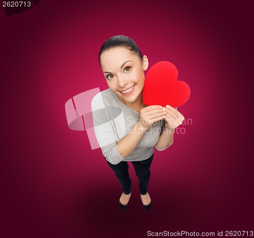 Image of smiling asian woman with red heart