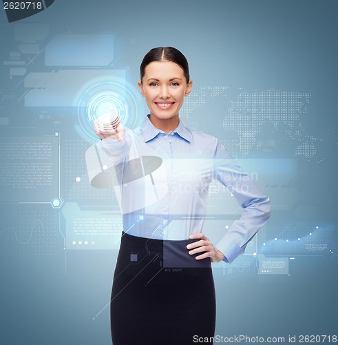 Image of smiling businesswoman pointing finger to button