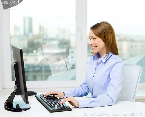 Image of smiling businesswoman or student with computer