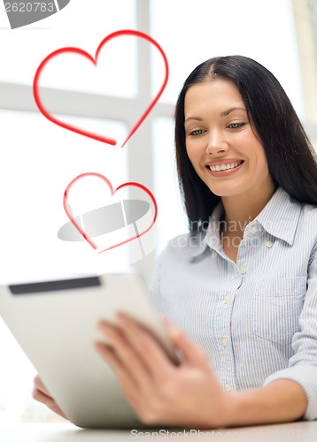 Image of smiling businesswoman or student with tablet pc