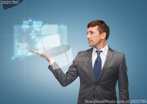 Image of buisnessman or teacher showing virtual screen