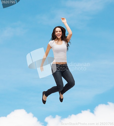 Image of teenage girl in white blank t-shirt jumping