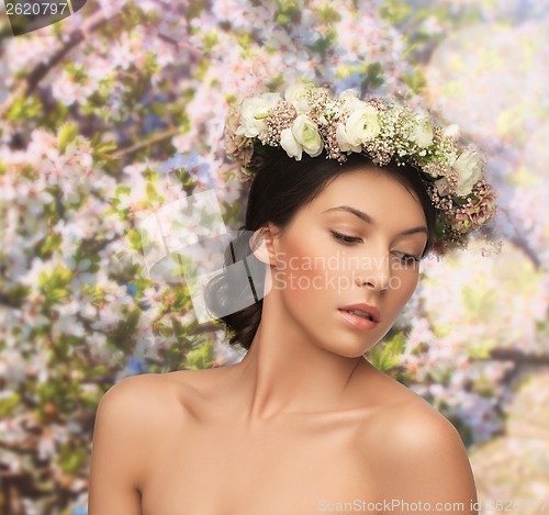 Image of woman wearing wreath of flowers