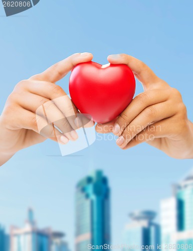 Image of woman hands with heart