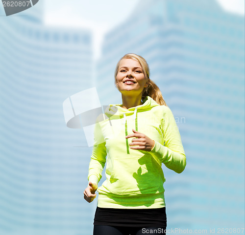 Image of woman jogging outdoors