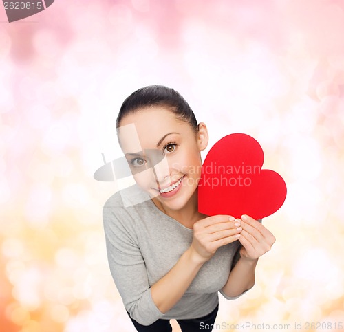 Image of smiling asian woman with red heart