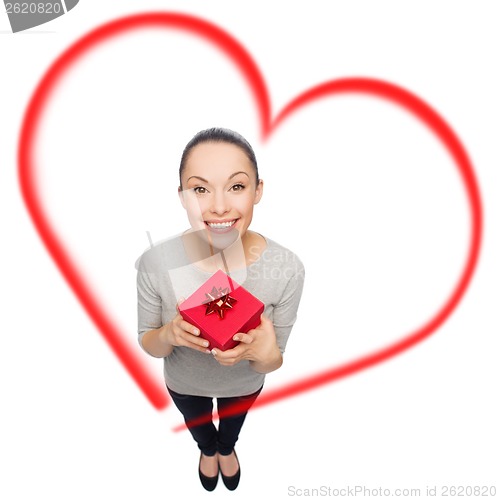 Image of smiling asian woman with red gift box