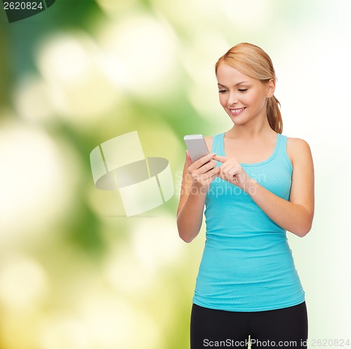 Image of sporty woman with smartphone