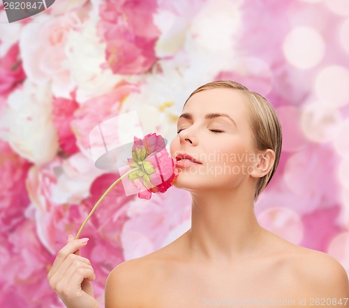 Image of lovely woman with peonie flower