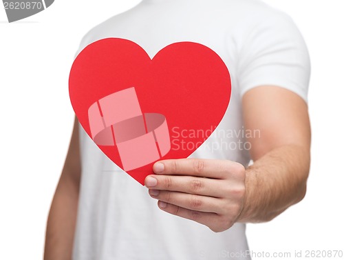 Image of closeup of man hands with heart