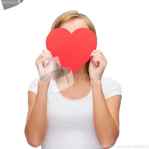 Image of woman in white t-shirt with heart