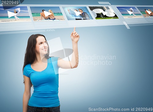 Image of smiling teenager pointing her finger videos