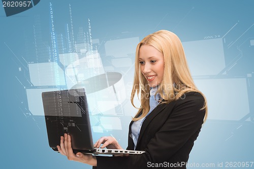 Image of smiling woman with laptop computer