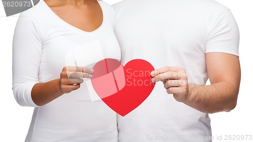 Image of closeup of couple hands with heart