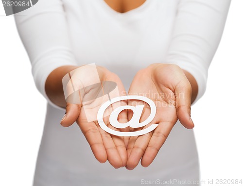 Image of womans cupped hands showing e-mail cutout sign