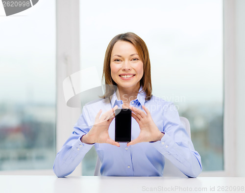 Image of businesswoman with blank smartphone screen