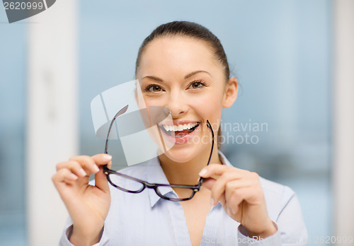 Image of laughing businesswoman with glasses