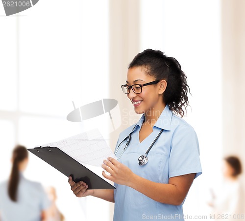 Image of smiling female african american doctor or nurse