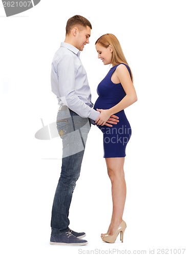 Image of happy young family expecting child