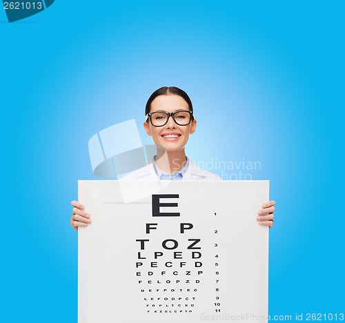 Image of female doctor in eyeglasses with eue chart